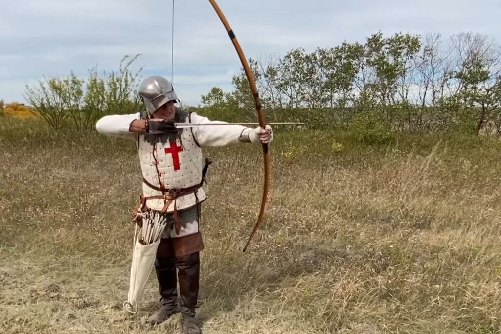 Different Types of Bows in Archery: An old man shoots a longbow.
